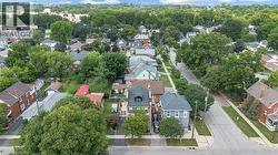 Aerial shot of the grand home in the mature neighbourhood. - 