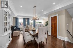 Looking from the kitchen island into the dining room and living room. - 