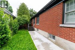 Red brick exterior with concrete foundation - 