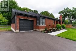 Brick exterior with a dark-paneled garage door - 