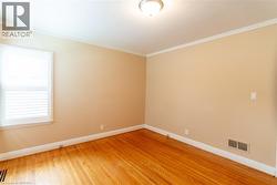 Warm wood-finish flooring complemented by neutral wall tones - 