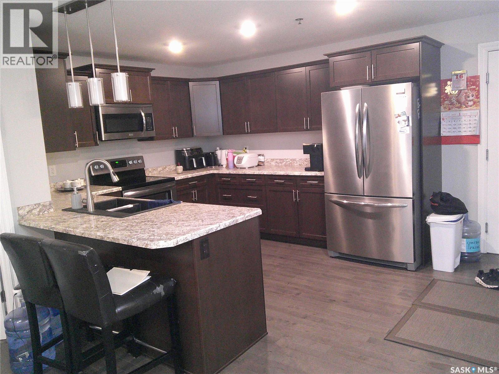 224 3630 Haughton Road E, Regina, SK - Indoor Photo Showing Kitchen With Stainless Steel Kitchen With Double Sink With Upgraded Kitchen