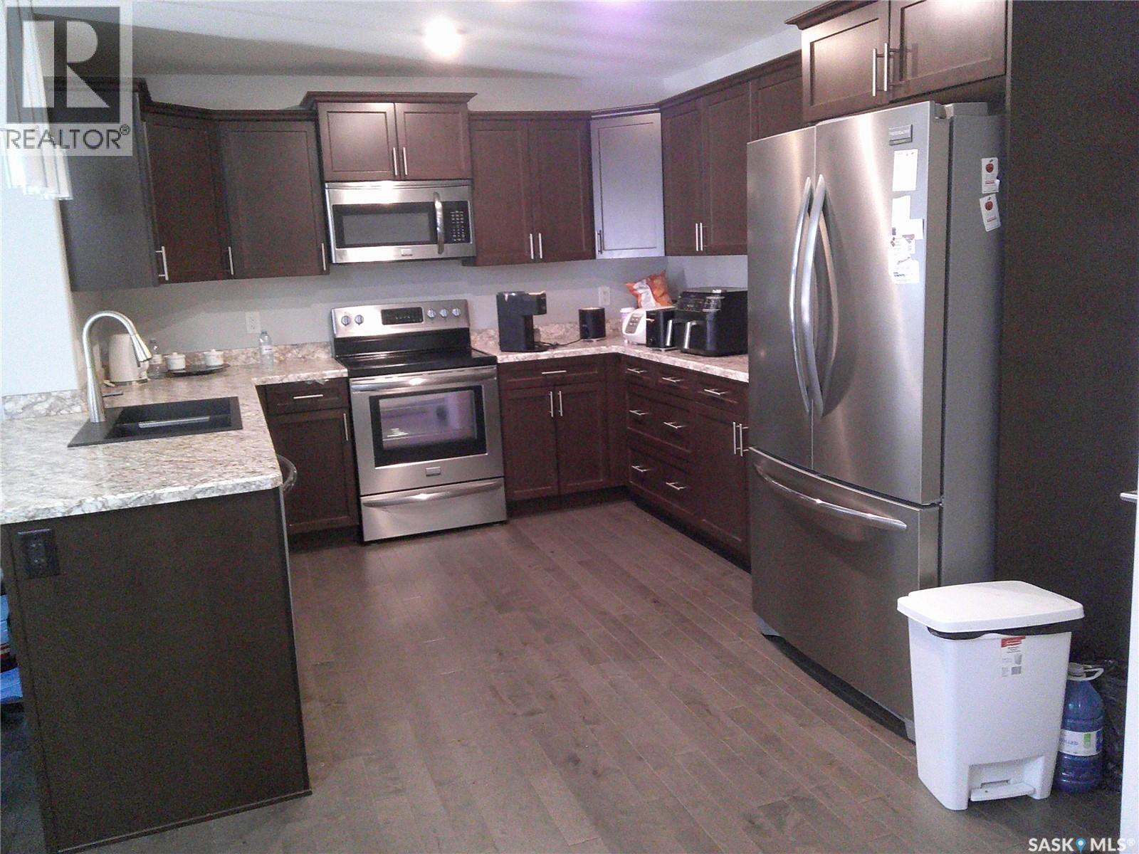 224 3630 Haughton Road E, Regina, SK - Indoor Photo Showing Kitchen With Stainless Steel Kitchen With Double Sink