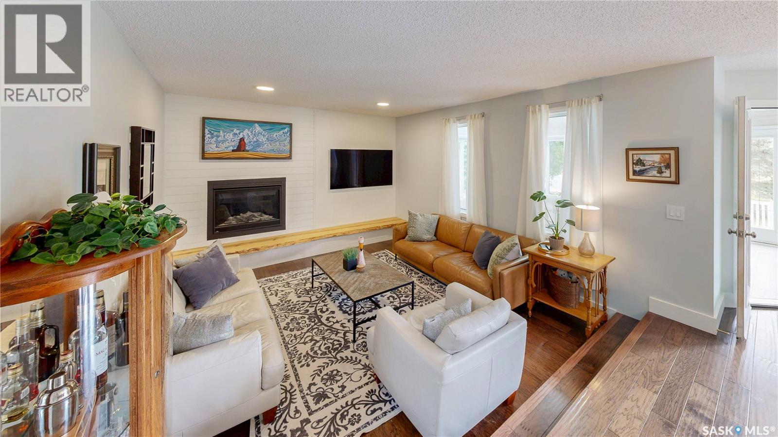 7551 Butler Bay, Regina, SK - Indoor Photo Showing Living Room With Fireplace