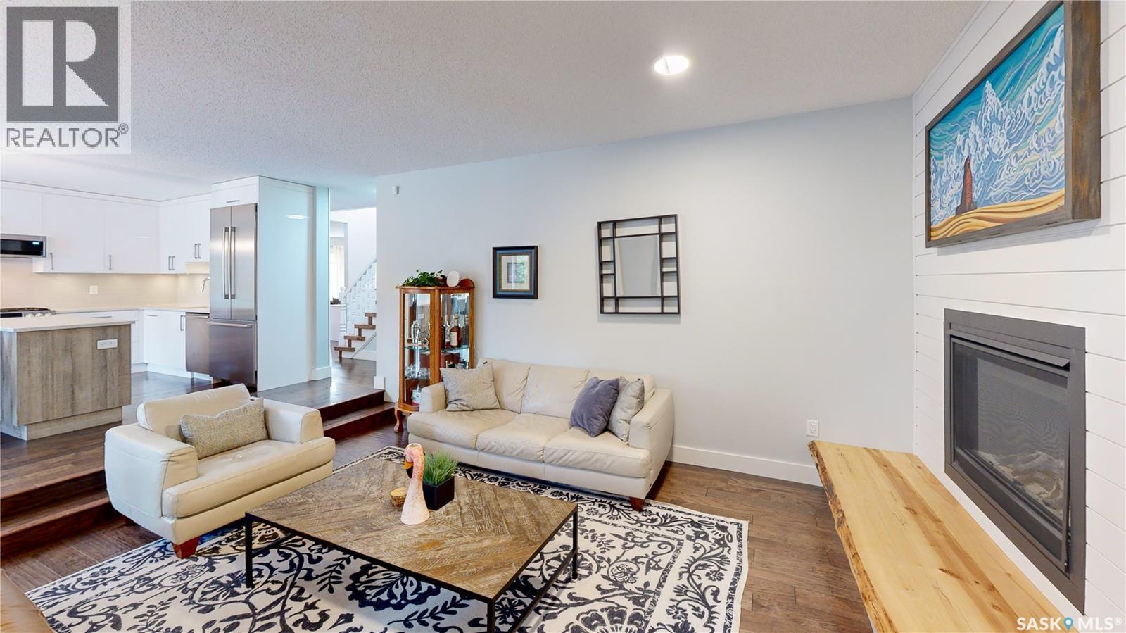 7551 Butler Bay, Regina, SK - Indoor Photo Showing Living Room With Fireplace