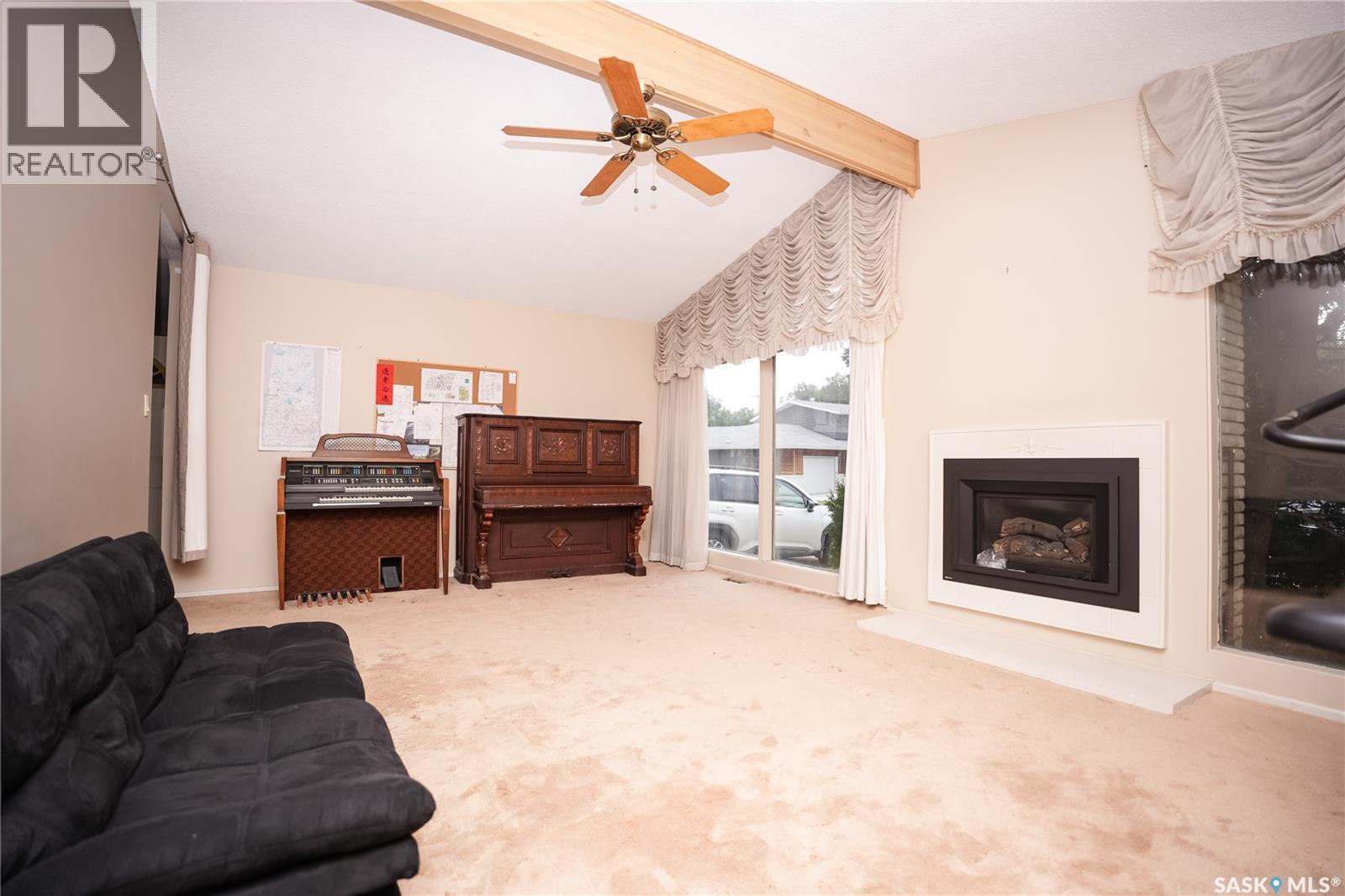 145 Mayfair Crescent, Regina, SK - Indoor Photo Showing Living Room With Fireplace