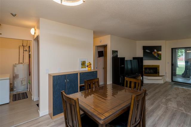 105-693 A St Anne'S Rd, Winnipeg, MB - Indoor Photo Showing Dining Room With Fireplace