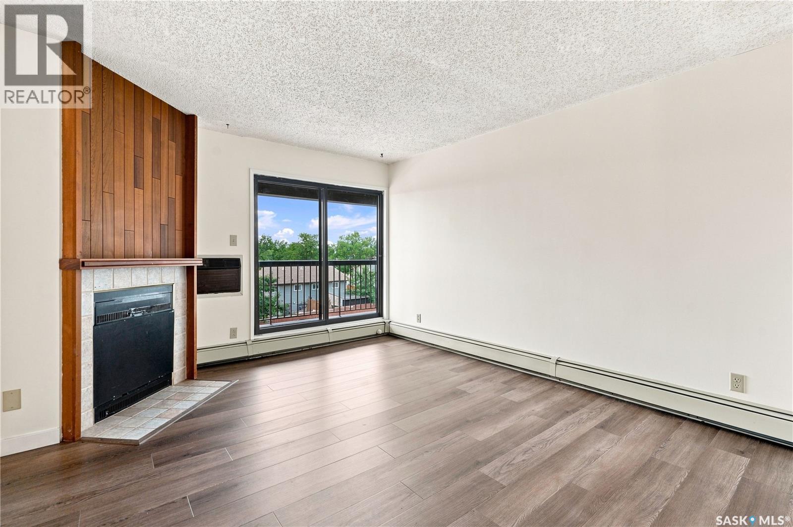 302 345 Kingsmere Boulevard, Saskatoon, SK - Indoor Photo Showing Living Room With Fireplace
