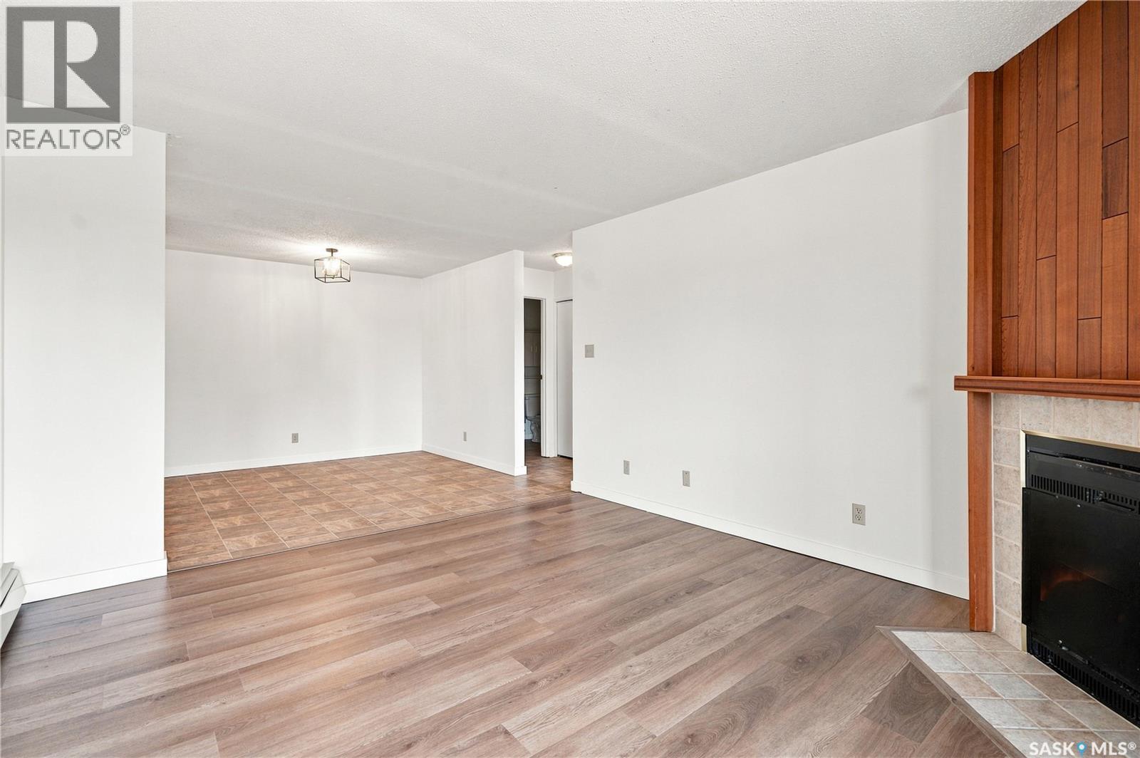 302 345 Kingsmere Boulevard, Saskatoon, SK - Indoor Photo Showing Other Room With Fireplace