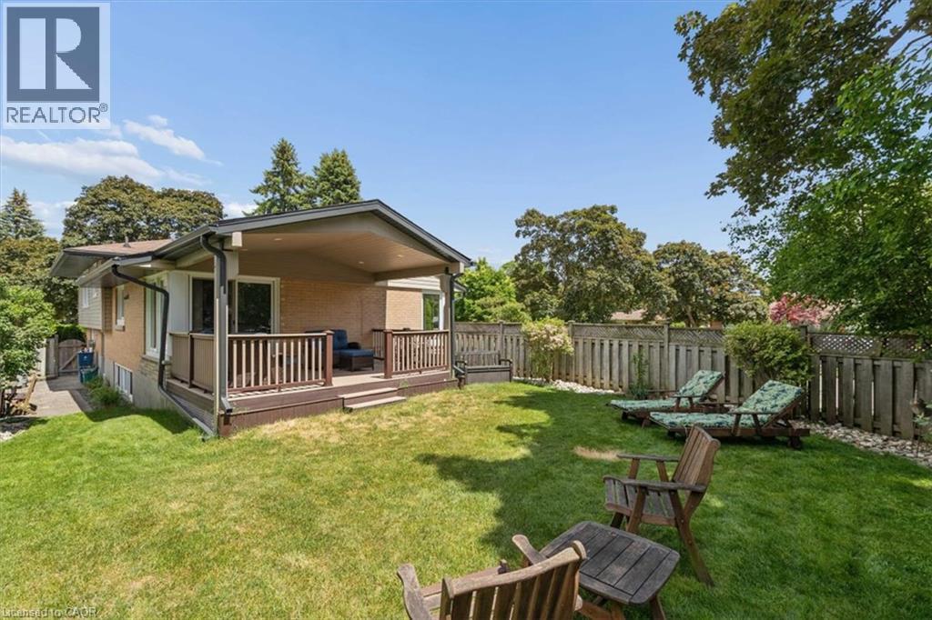 Covered rear deck and private yard that is fully fenced. - 138 Blueridge Avenue, Kitchener, ON