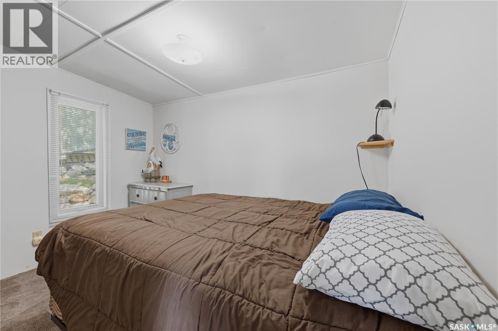 65 Pelican Drive, Pelican Pointe, SK - Indoor Photo Showing Bedroom