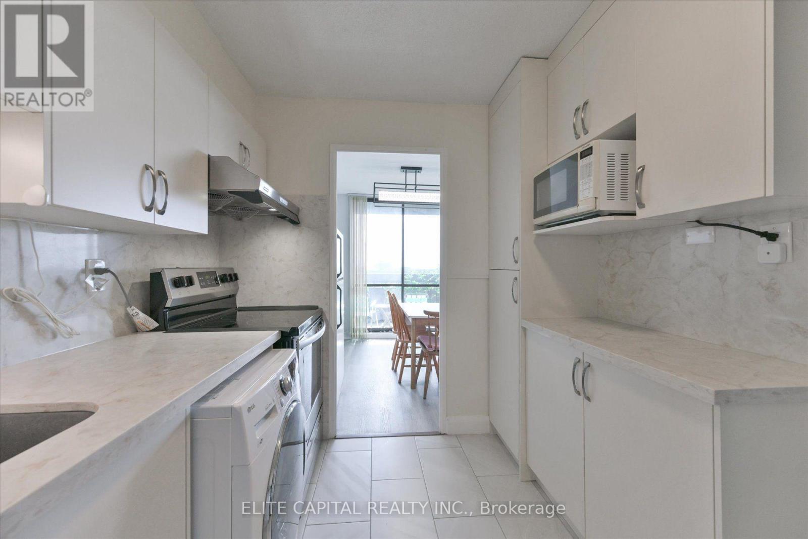 #1710 - 11 Wincott Drive, Toronto, ON - Indoor Photo Showing Kitchen