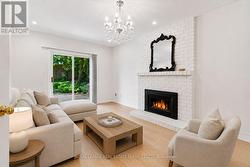 Virtually Staged - Family Room w/a Brick Fireplace - 