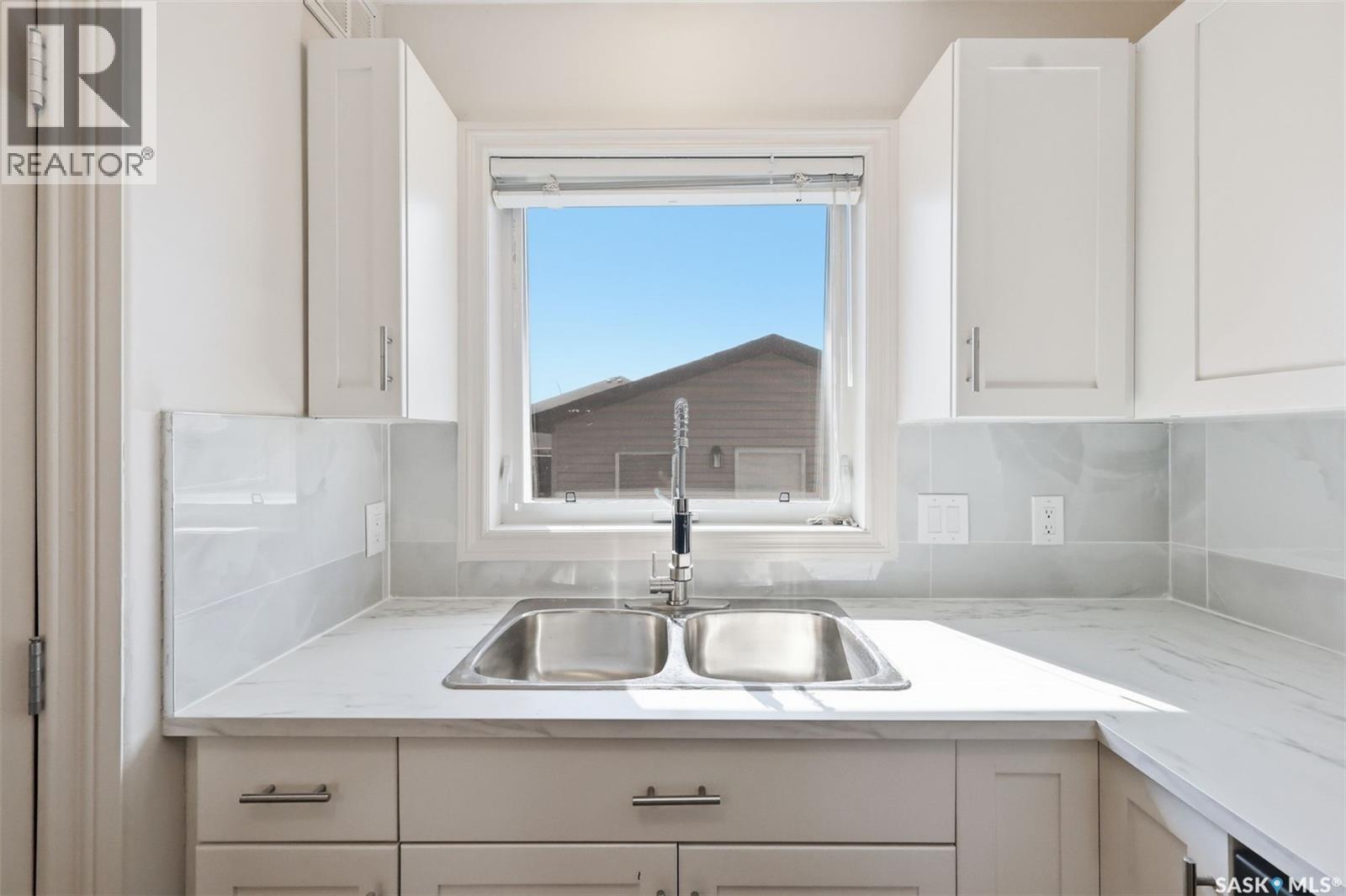 738 Lamarsh Lane, Saskatoon, SK - Indoor Photo Showing Kitchen With Double Sink