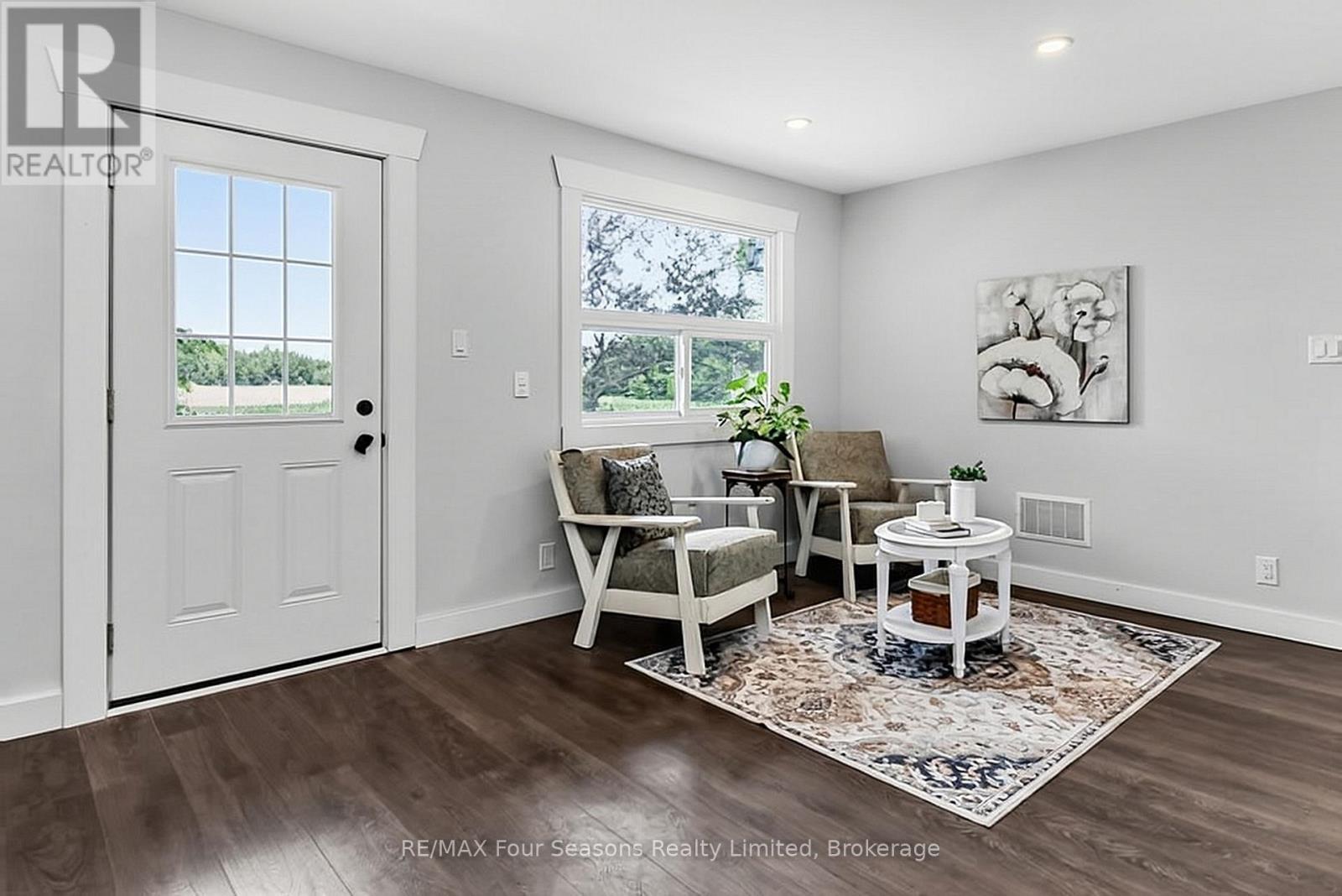 Front door to porch - 7363 Sideroad 33 34 Road, Clearview, ON - Indoor Photo Showing Living Room