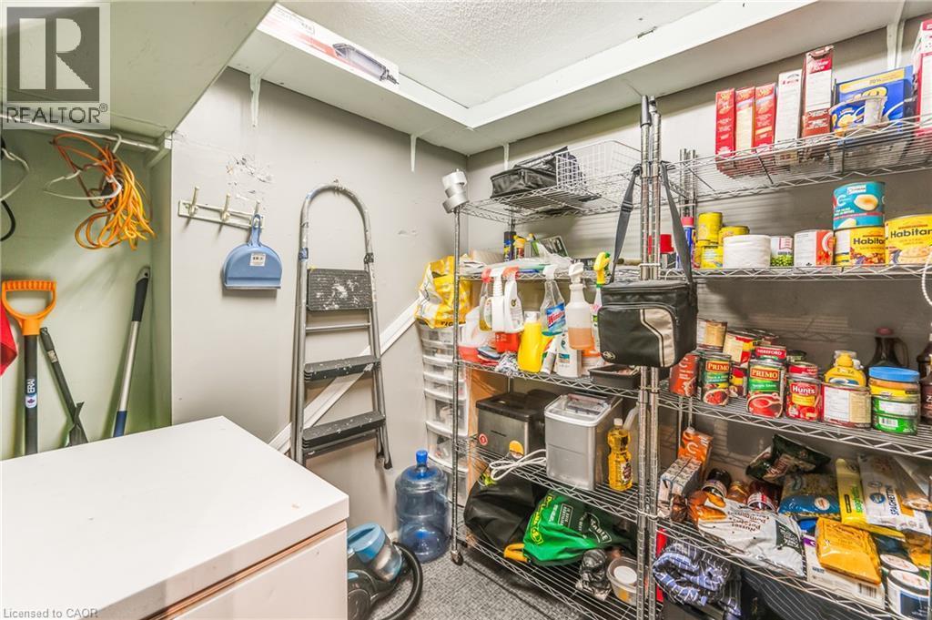 Built-in shelving for organized storage - 975 Warwick Court Unit# 708, Burlington, ON - Indoor