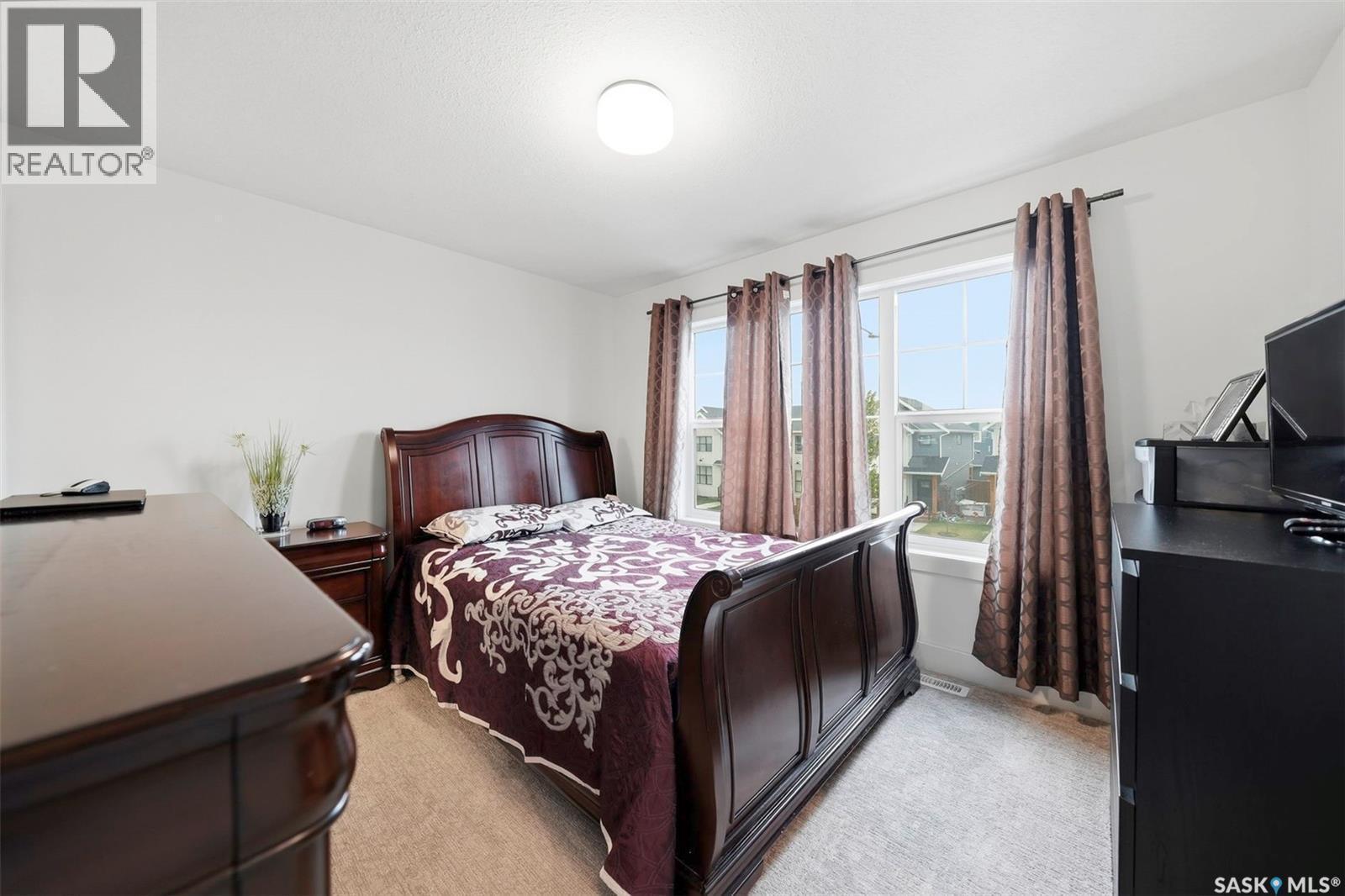 132 Rosewood Boulevard E, Saskatoon, SK - Indoor Photo Showing Bedroom