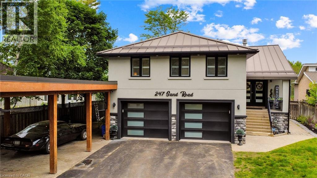 Contemporary stucco facade featuring a metal roof and an attached carport - 247 Sand Road, Holland Landing, ON - Outdoor