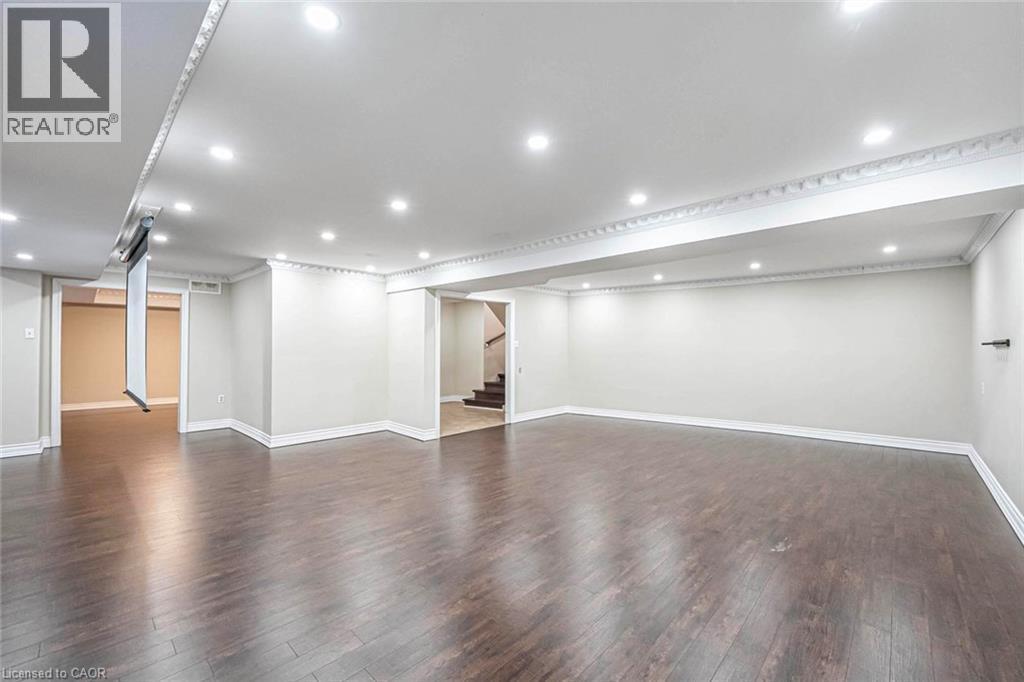 Spacious room featuring dark wood-finish flooring, recessed lighting, and crown molding - 247 Sand Road, Holland Landing, ON - Indoor Photo Showing Other Room
