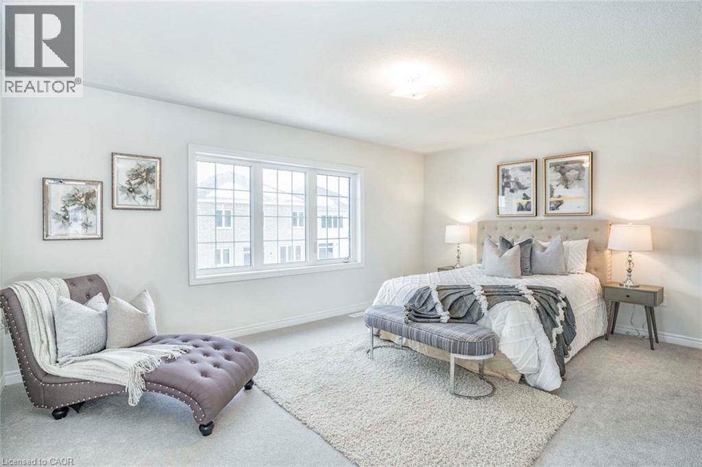 Wall-to-wall carpeting and a large multi-pane window - 525 Red Elm Road, Shelburne, ON - Indoor Photo Showing Bedroom