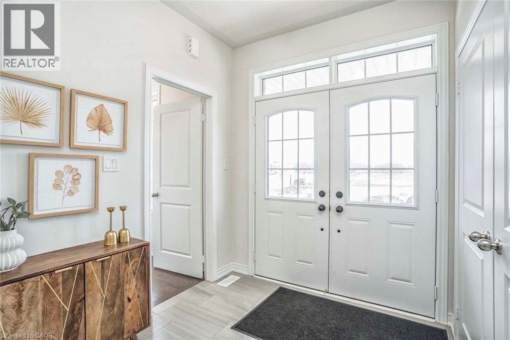 Double entry doors with divided lites and transom windows - 525 Red Elm Road, Shelburne, ON - Indoor Photo Showing Other Room