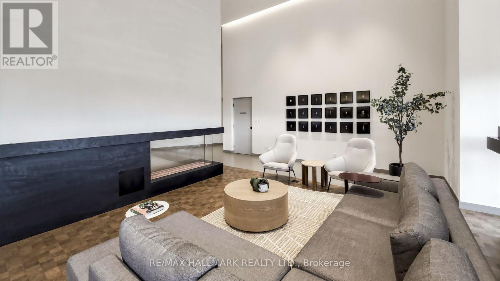 823 - 1050 Eastern Avenue, Toronto, ON - Indoor Photo Showing Living Room With Fireplace