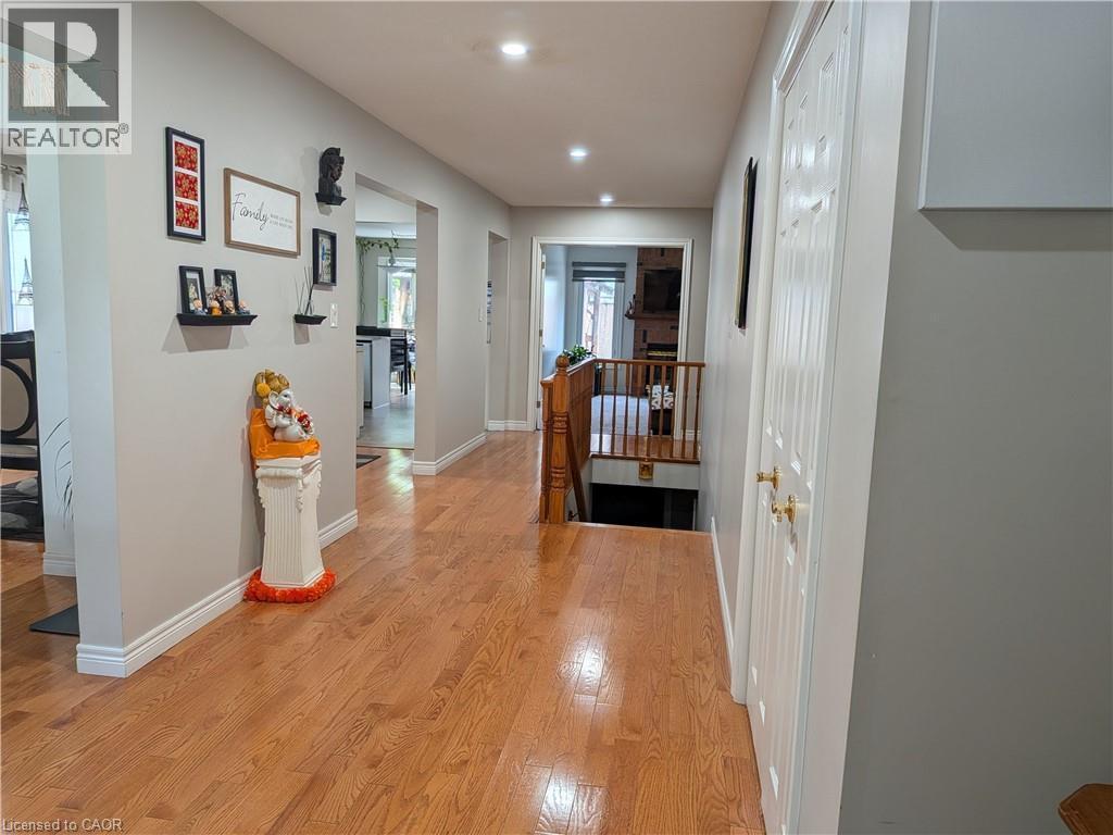 Hardwood flooring throughout, recessed lighting, and crisp white trim - 45 Caswell Drive Unit# Upper, Hamilton, ON - Indoor Photo Showing Other Room