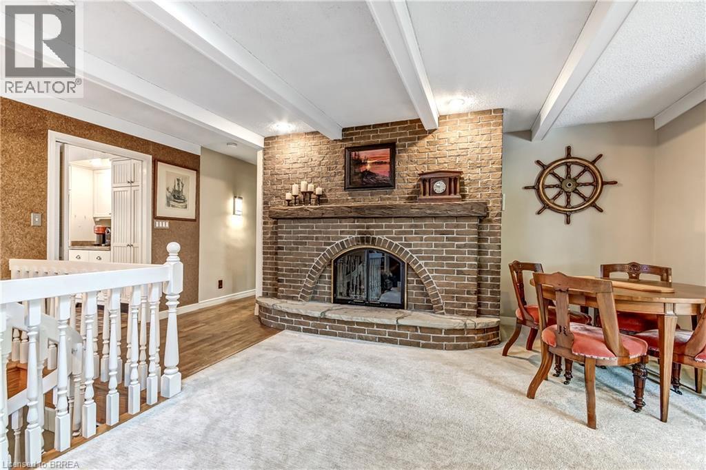 19 Oakley Road, Brantford, ON - Indoor Photo Showing Other Room With Fireplace