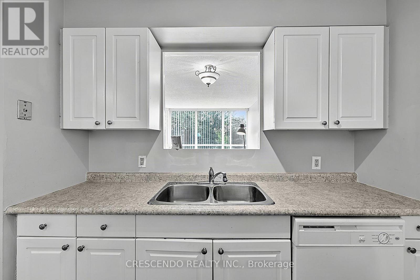 201 - 100 Millside Drive, Milton, ON - Indoor Photo Showing Kitchen With Double Sink