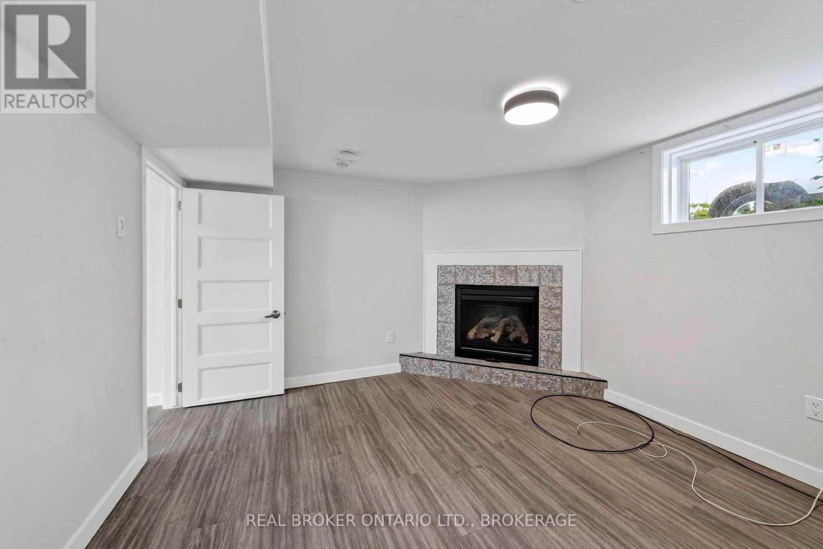 48 Bryden Avenue, Cornwall, ON - Indoor Photo Showing Living Room With Fireplace