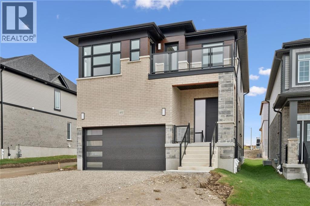Modern exterior featuring light brick and stone accents - 451 Benninger Street, Kitchener, ON