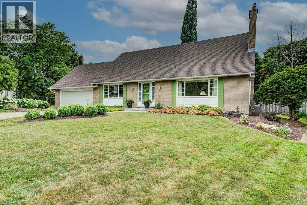 Brick exterior featuring a gabled roof and light green shutters - 97 Somerset Crescent, Waterloo, ON - Outdoor