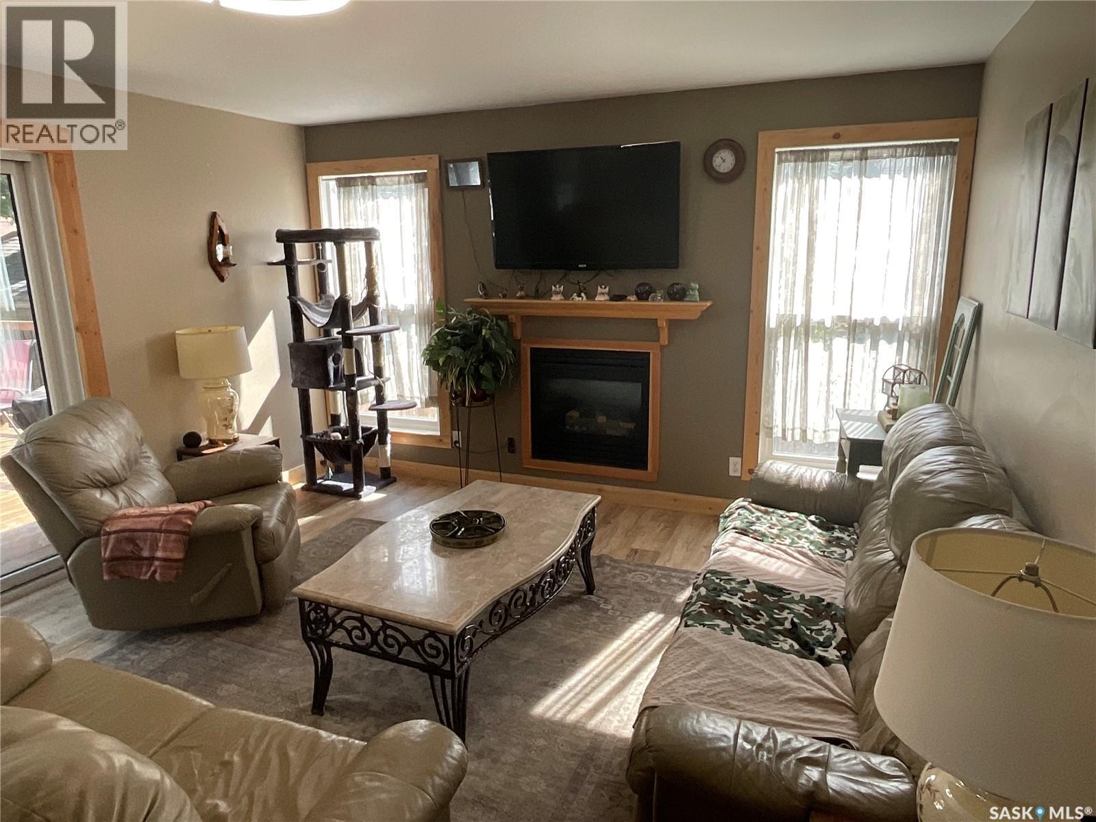2018 8Th Street, Rosthern, SK - Indoor Photo Showing Living Room With Fireplace