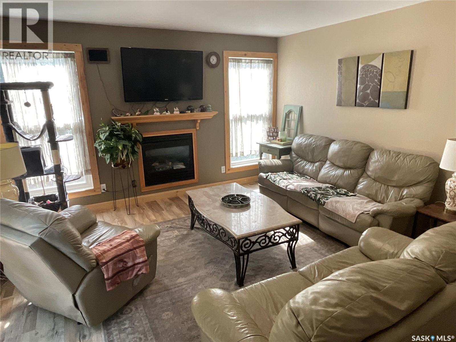 2018 8Th Street, Rosthern, SK - Indoor Photo Showing Living Room With Fireplace