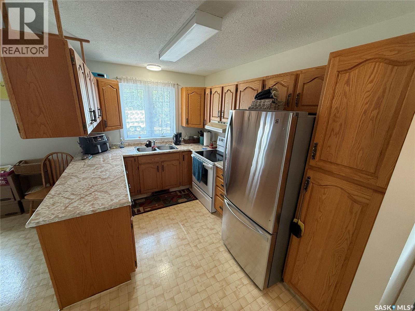705 Northridge Court, Shellbrook, SK - Indoor Photo Showing Kitchen With Double Sink