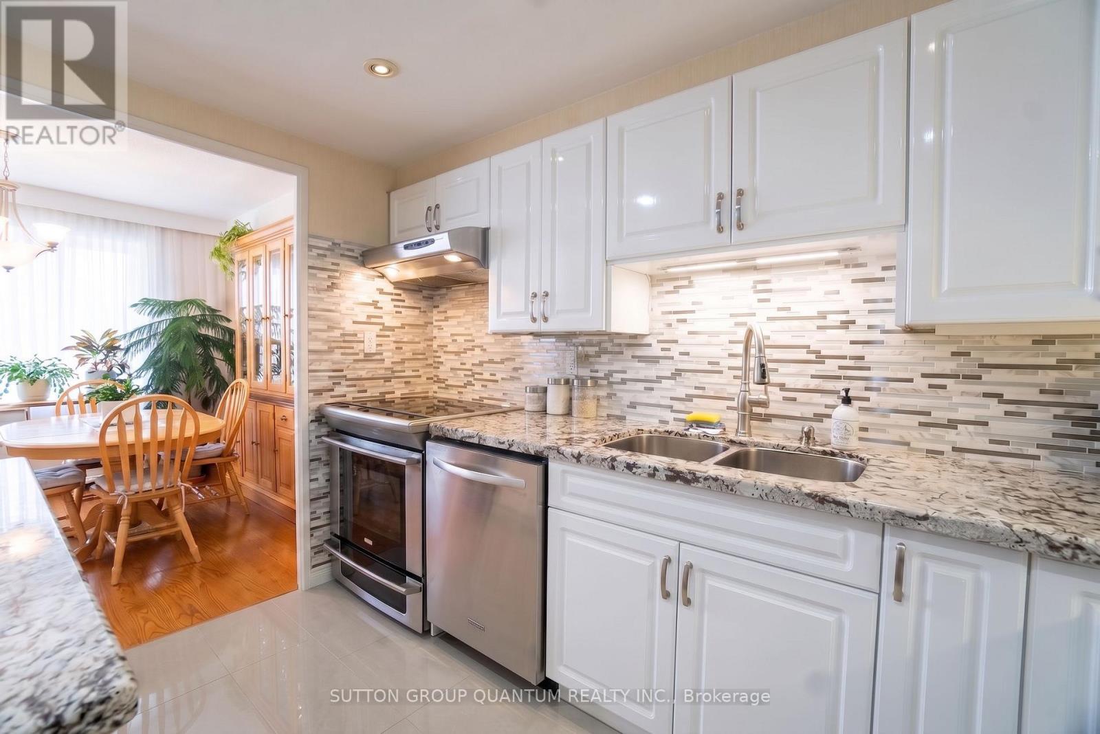 1810 - 11 Wincott Drive, Toronto, ON - Indoor Photo Showing Kitchen With Stainless Steel Kitchen With Double Sink With Upgraded Kitchen