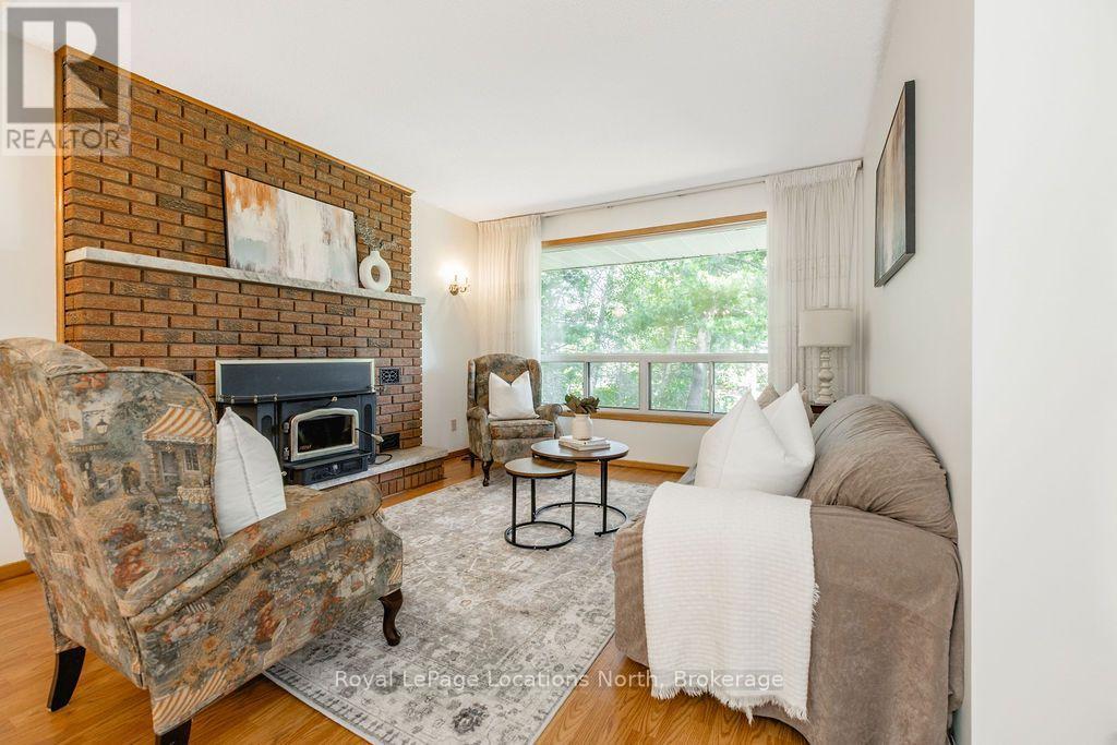 1928 Champlain Road, Tiny, ON - Indoor Photo Showing Living Room With Fireplace