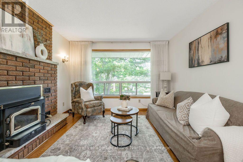 1928 Champlain Road, Tiny, ON - Indoor Photo Showing Living Room With Fireplace
