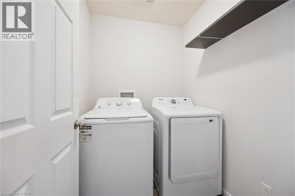 Dedicated laundry area with a built-in shelf - 360 Freure Drive, Cambridge, ON - Indoor Photo Showing Laundry Room