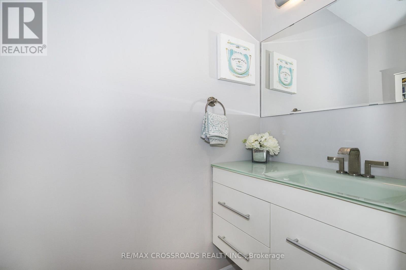 Floating Vanity & Vinyl Plank Flooring - 655 Dodsworth Crescent, Mississauga, ON - Indoor Photo Showing Bathroom