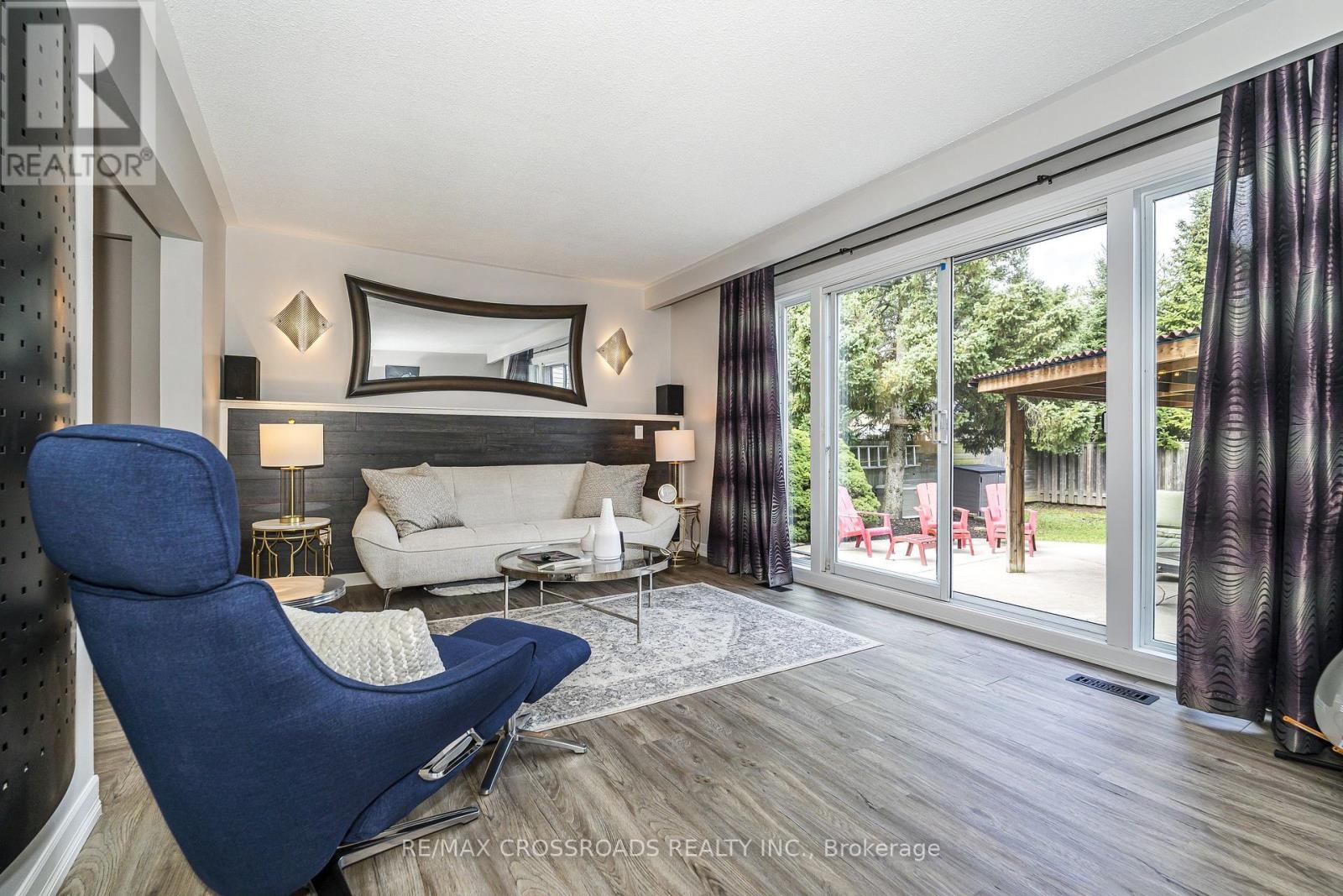 Wall to Wall Sliding W/Out to Entertainer's Gazebo - 655 Dodsworth Crescent, Mississauga, ON - Indoor Photo Showing Living Room