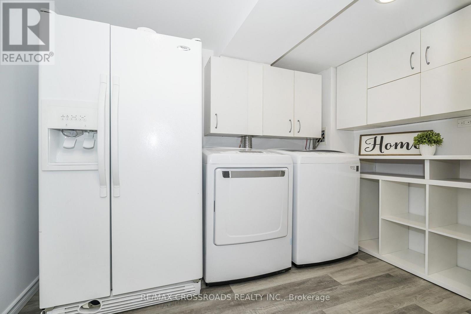 Modern Laundry Area with Storage - 655 Dodsworth Crescent, Mississauga, ON - Indoor Photo Showing Laundry Room