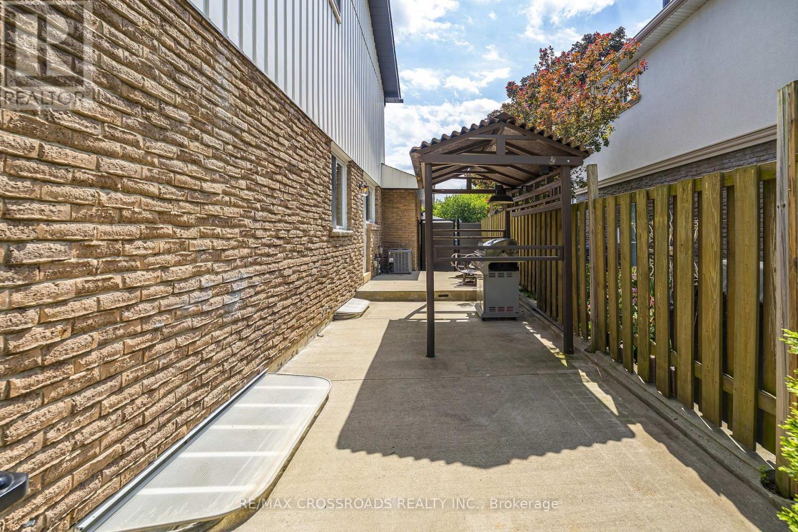 Shelter for BBQ with Direct Entry to the Kitchen.. - 655 Dodsworth Crescent, Mississauga, ON - Outdoor