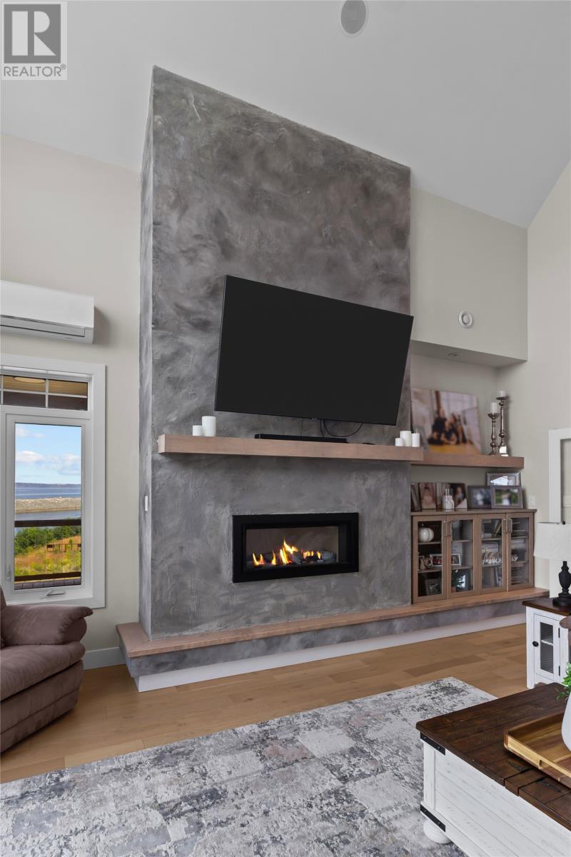 7 Commodore Place, Conception Bay South, NL - Indoor Photo Showing Living Room With Fireplace