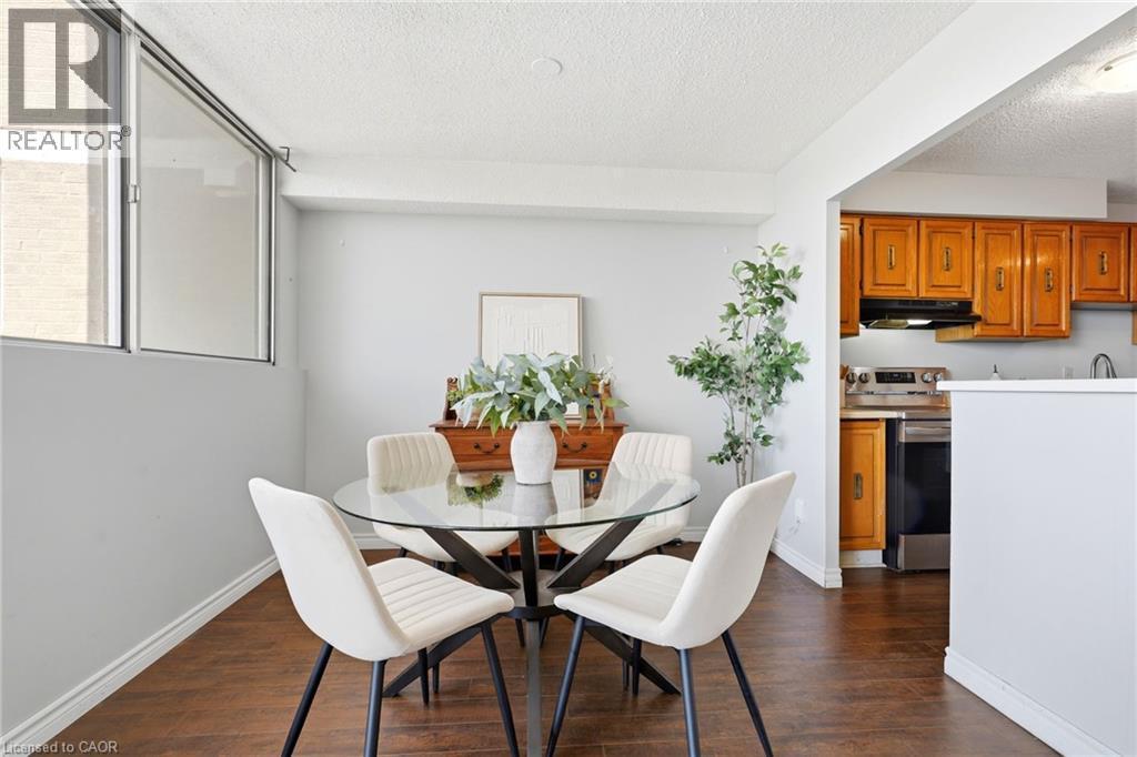 Wood-finish flooring throughout - 375 King Street N Unit# 708, Waterloo, ON - Indoor Photo Showing Dining Room