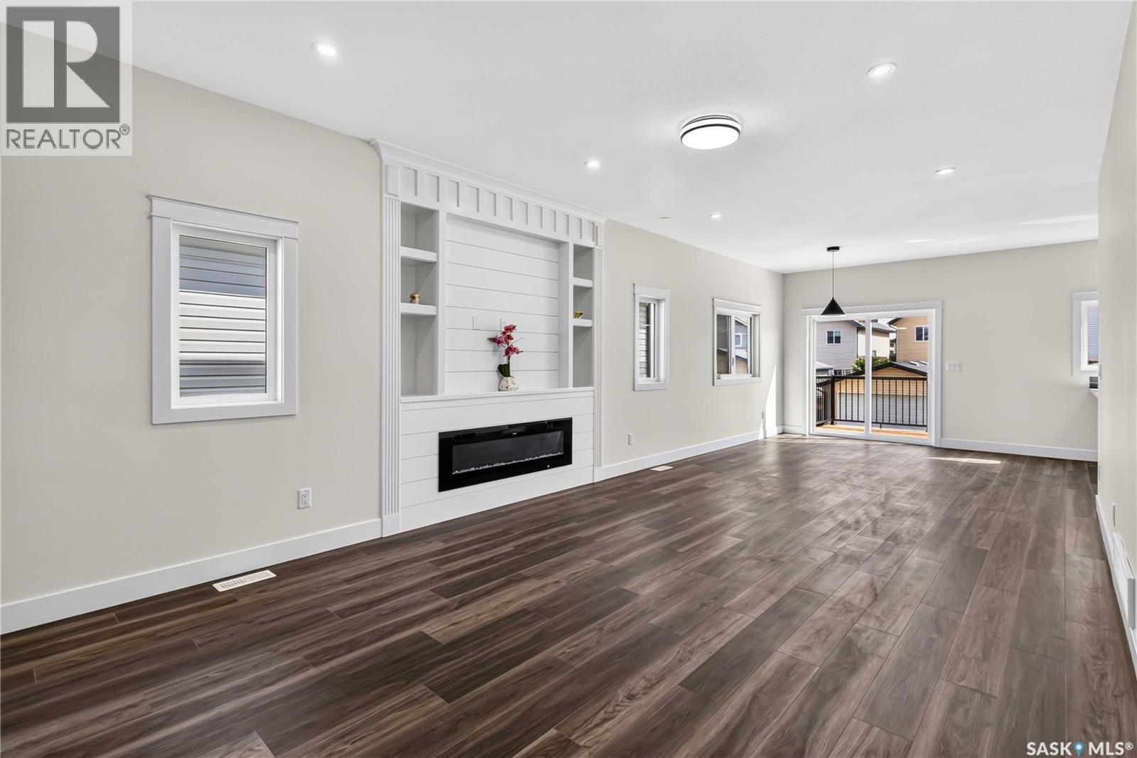 1211 Nightingale Terrace, Saskatoon, SK - Indoor Photo Showing Other Room With Fireplace