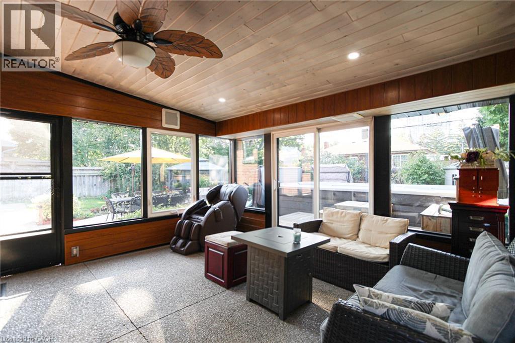 Sunroom featuring a wood-paneled ceiling, recessed lighting, ceiling fan, and large windows - 2105 Maplewood Drive, Burlington, ON - Indoor Photo Showing Other Room