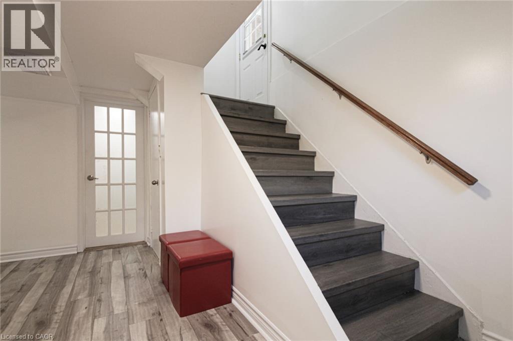 Wood-finish flooring with a light grey tone - 2105 Maplewood Drive, Burlington, ON - Indoor Photo Showing Other Room