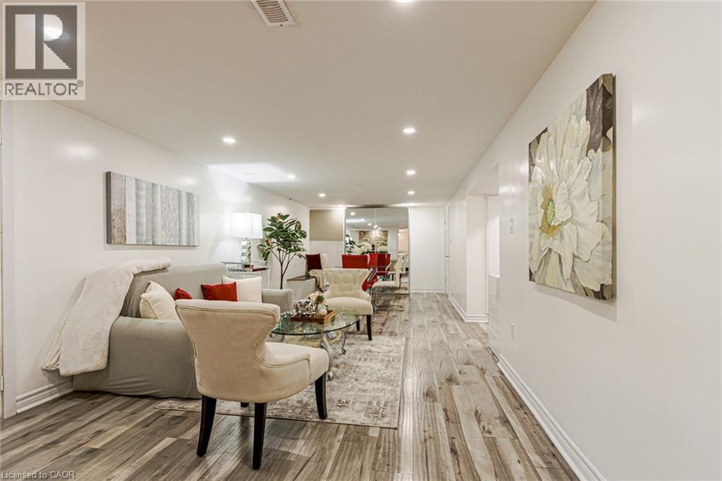 Recessed ceiling lighting, wood-finish flooring, white walls, and white trim - 2105 Maplewood Drive, Burlington, ON - Indoor