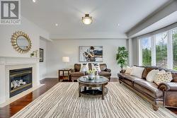 Family Room Features Fireplace, Large Bow Windows - 